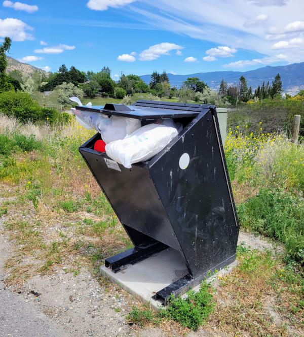 20240614 West Bench community pedestrian corridor bear bin overflowing resized